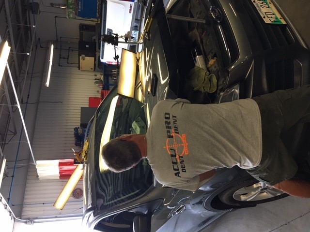 Repaired vehicle dent using paintless dent removal